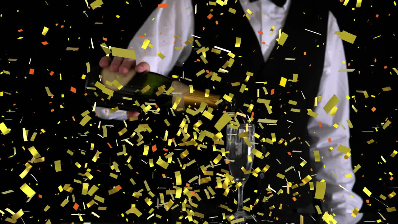 Golden confetti falling over mid section of bartender pouring champagne into a glass