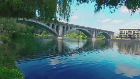 Pont-du-Chemin-de-Fer,-railway-bridge-at-Huy-on-a-summer-day,-The-Maas,-Huy,-Belgium,-4k,-50fps