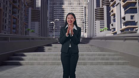 an asian business woman clapping her hands in urban city