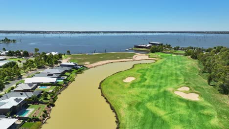 modern homes along a waterway with the sebel hotel yarrawonga beyond