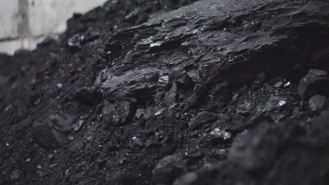 textured charcoal pile in power generating station storage