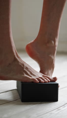 yoga feet on block