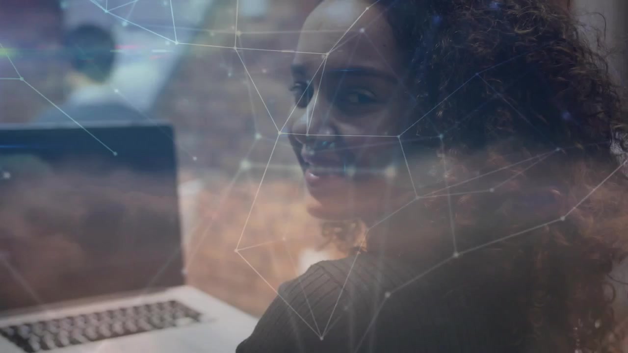 Woman typing on laptop, turning and smiling after camera move, tech nodes or cloud overlaying, watch