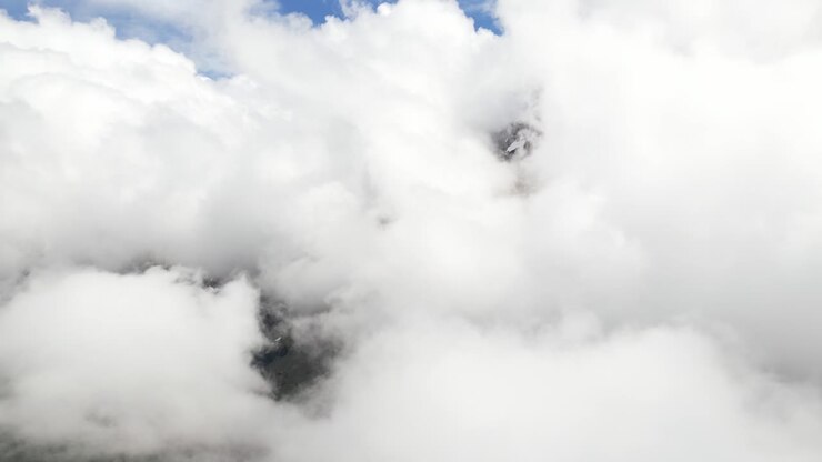 Fronalpstock Glarus Switzerland aerial above the clouds as they roll in the sky