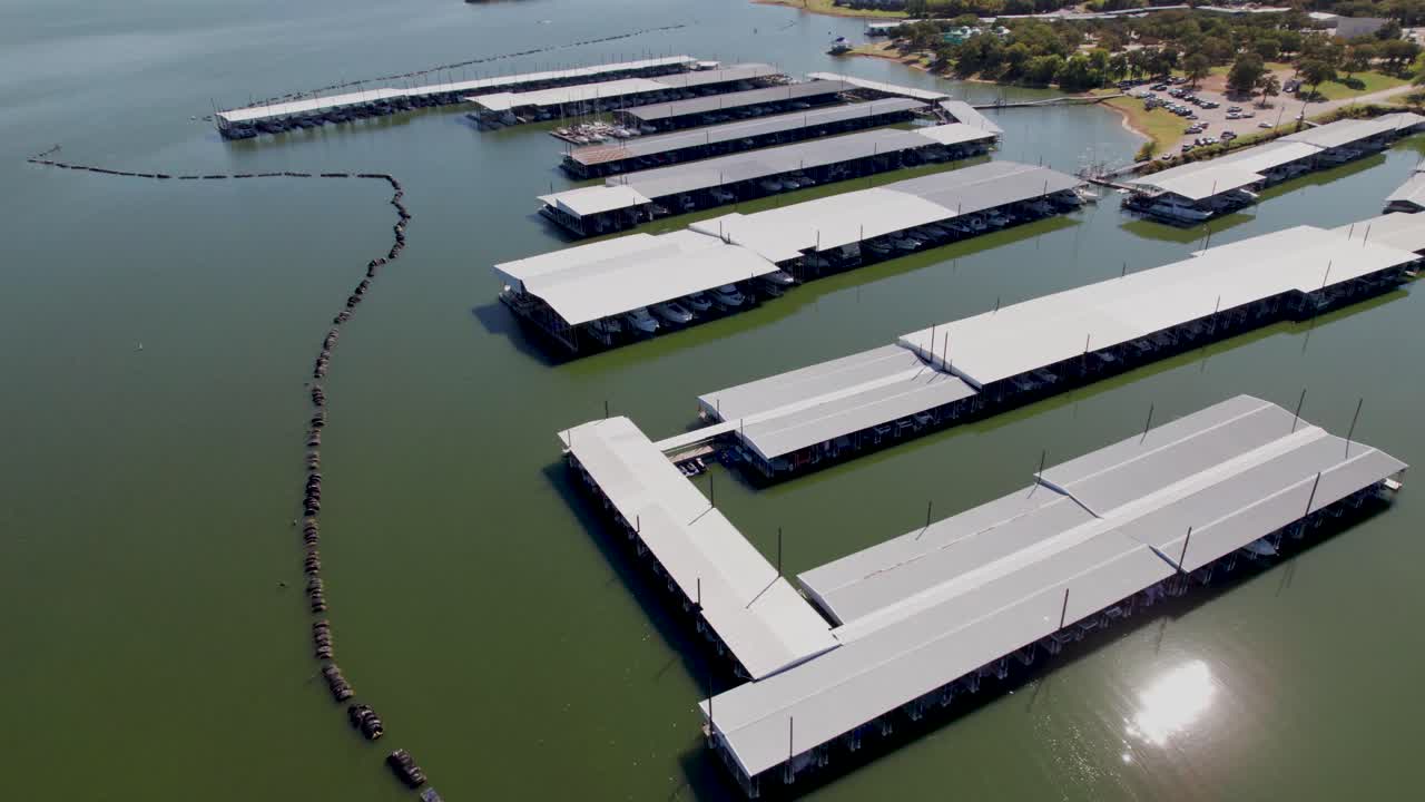 Aerial flight over Eagle Point Marina on Lake Lewisville. Camera rotates in a point of interest style clockwise