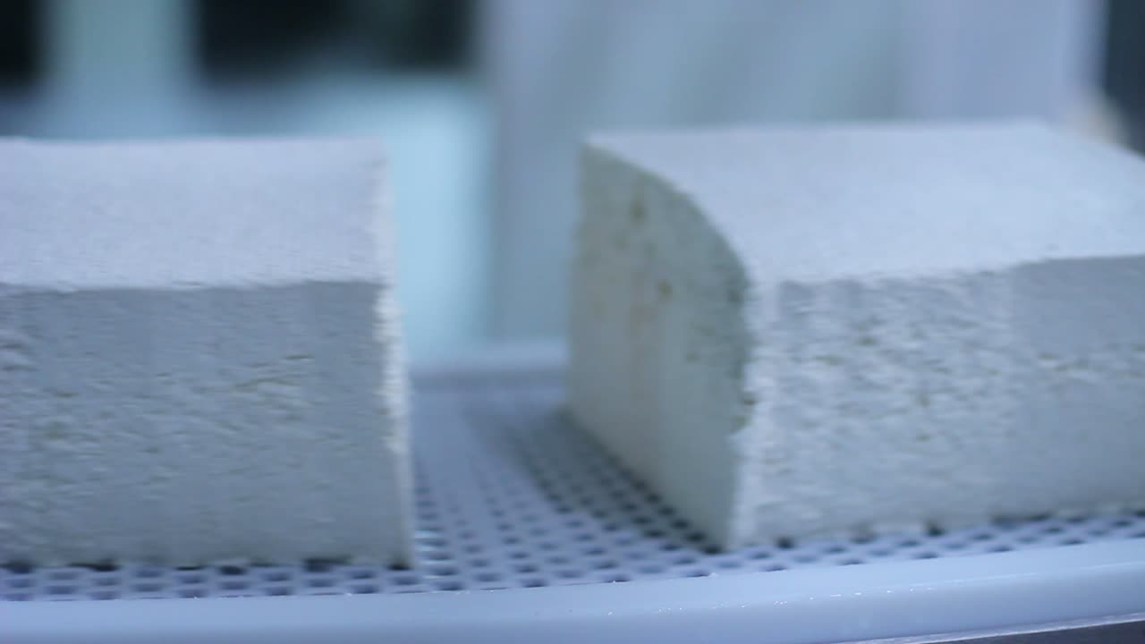 Production of cottage cheeses in factory. Cheese production line