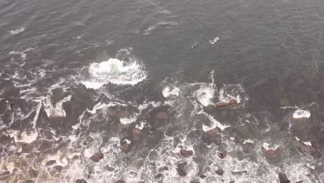 waves-crashing-against-the-rock-cliffs-on-Isle-of-Skye,-hIghlands-of-Scotland