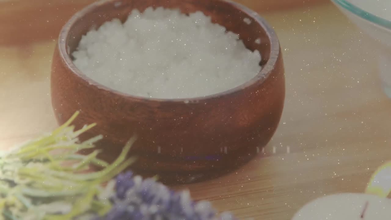 Animation af lyspletter over spa-udstyr, stearinlys og blomster