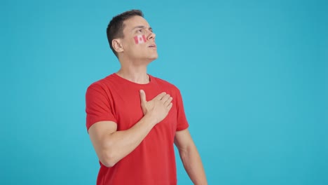 Man listening to the Canada national anthem with solemnity