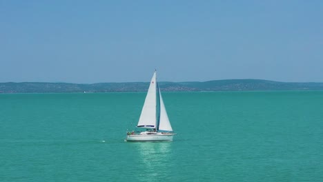 lower altitude forward movement areial footage from a slow moving sailboat at lake balaton.