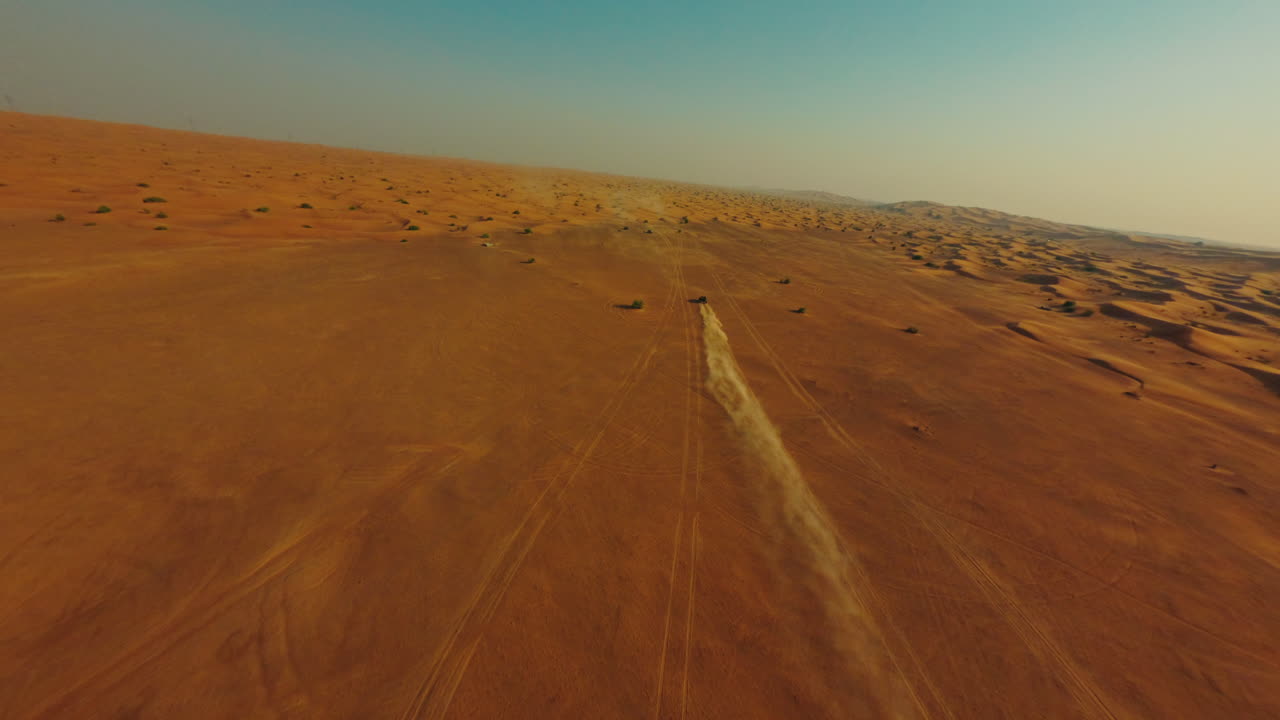 Drone Shot of ATV Four Wheeler Vehicle Moving in Landscape of Dubai Desert UAE