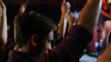 group of people dancing at a concert 4k