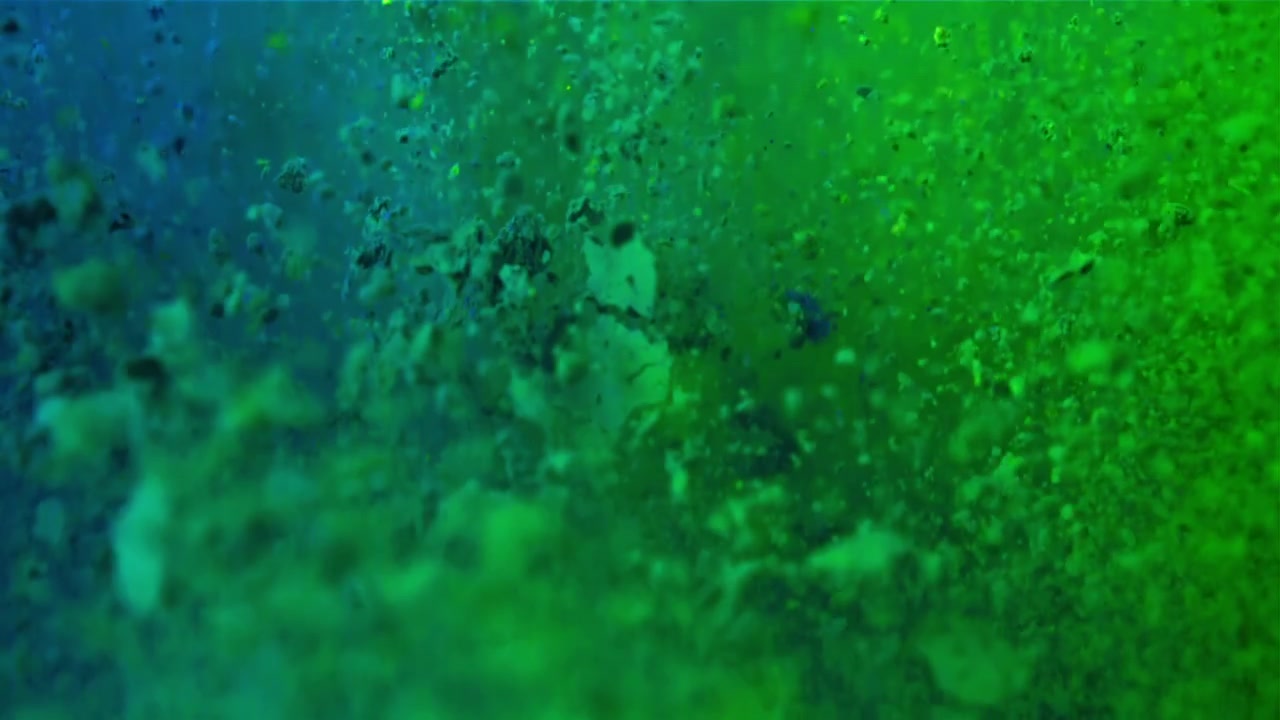 Sfondo astratto dinamico di particelle verdi e blu fluttuanti