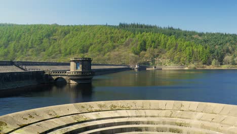 lady bower reservoir plug hole in foreground of clip giant plug hole famous attraction summer sunny day clear skies calm waves in the peak district shot in 4k