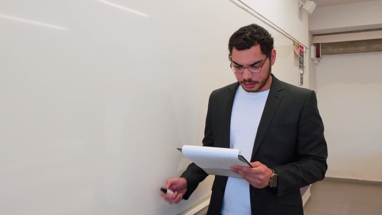 Teacher Using Notes to Write on the Board