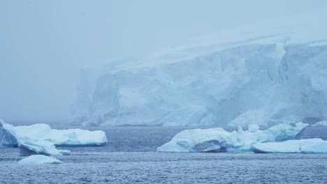 Blue-Ice-Glacier-and-Icebergs-in-Antarctica-Winter-Scenery-Landscape,-Cold-Scene-with-Southern-Ocean-Sea-Water-and-Icy-Weather-in-Antarctic-Peninsula,-Global-Warming-and-Climate-Change