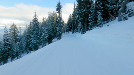 POV-shot-of-a-snowboarder-riding-through-a-ski-resort