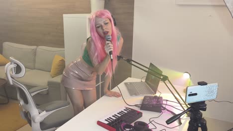 woman singing and recording music in home studio