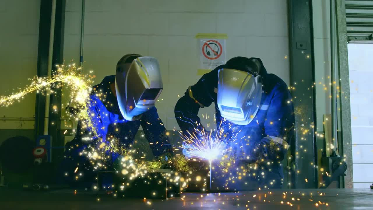 Animation of glowing shooting star over male engineers welding