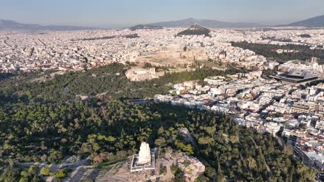Drone-flight-over-the-Acropolis-and-the-Philoppapos-monument-in-Athens,-Greece