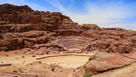 panorama of stunning petra, jordan, west asia. tourists walk by the famous landmark sightseeing.