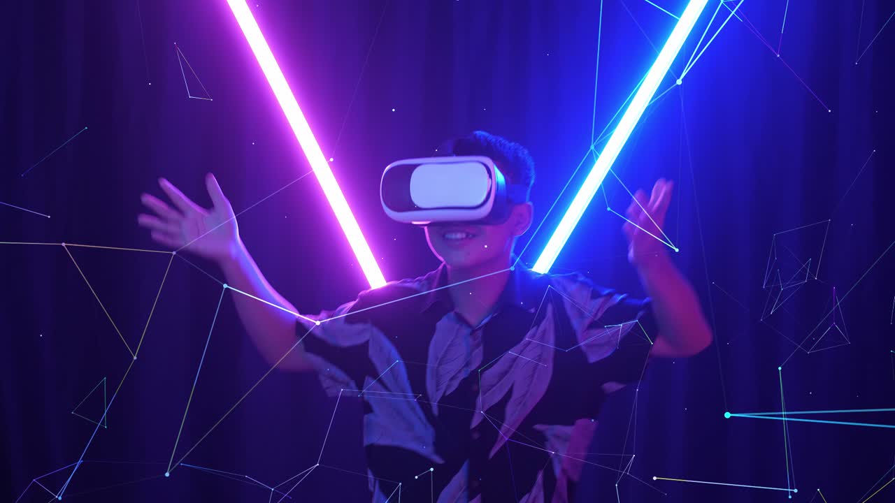 Vr, Futuristic, Entertainment Concept. Excited Asian Boy Using Virtual Reality Headset And Funny Dance With Neon Light At The Background