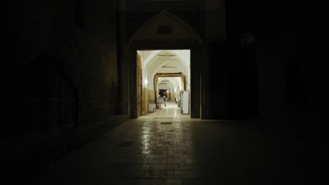 khiva wooden gates to ichan kala fort, old city in the evening. uzbekistan silk road 6