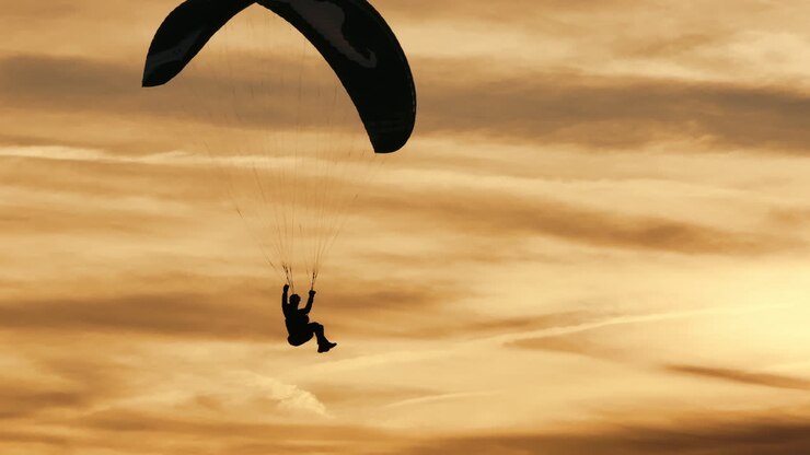 Silhouette of Paraglider at Sunset