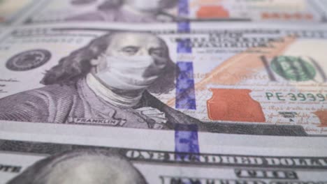 100 dólares en una máscara médica. la economía global durante la pandemia de covid-19. imágenes de alta calidad en 4k