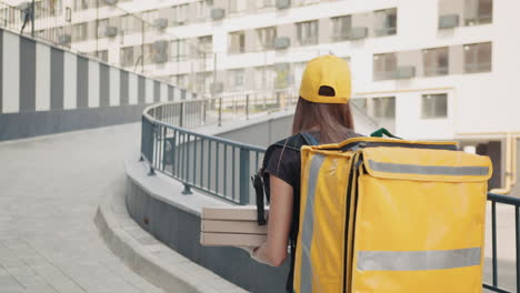 woman delivering food in urban environment