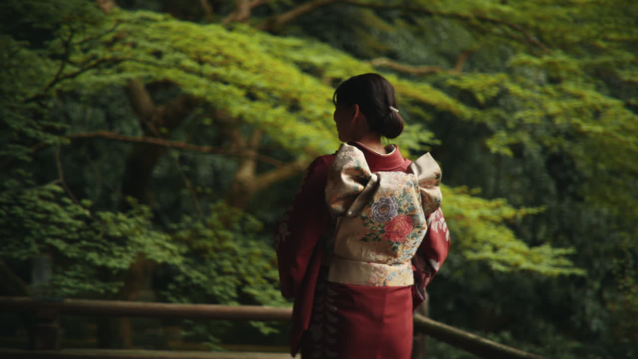 Woman in Kimono in a Lush Green Setting