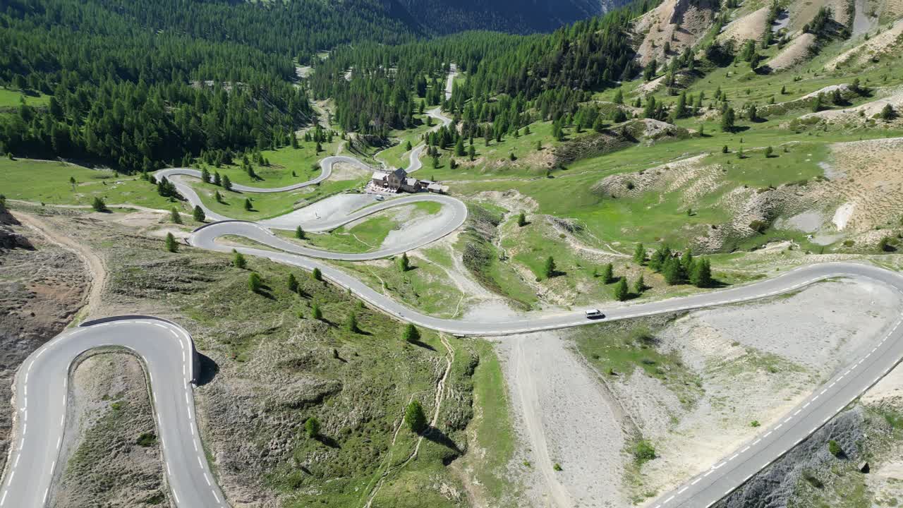 Scenic Road Col Izoard Mountain Pass in French Alps, France - Aerial 4k Reveal Tilting Up
