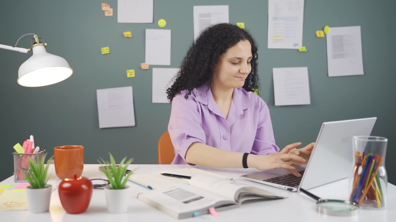 Satisfied Female student at pc.