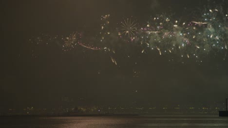 Slow-motion-of-fireworks-reflecting-on-the-surface-water-kighting-up-the-sky-on-Qatar-National-day