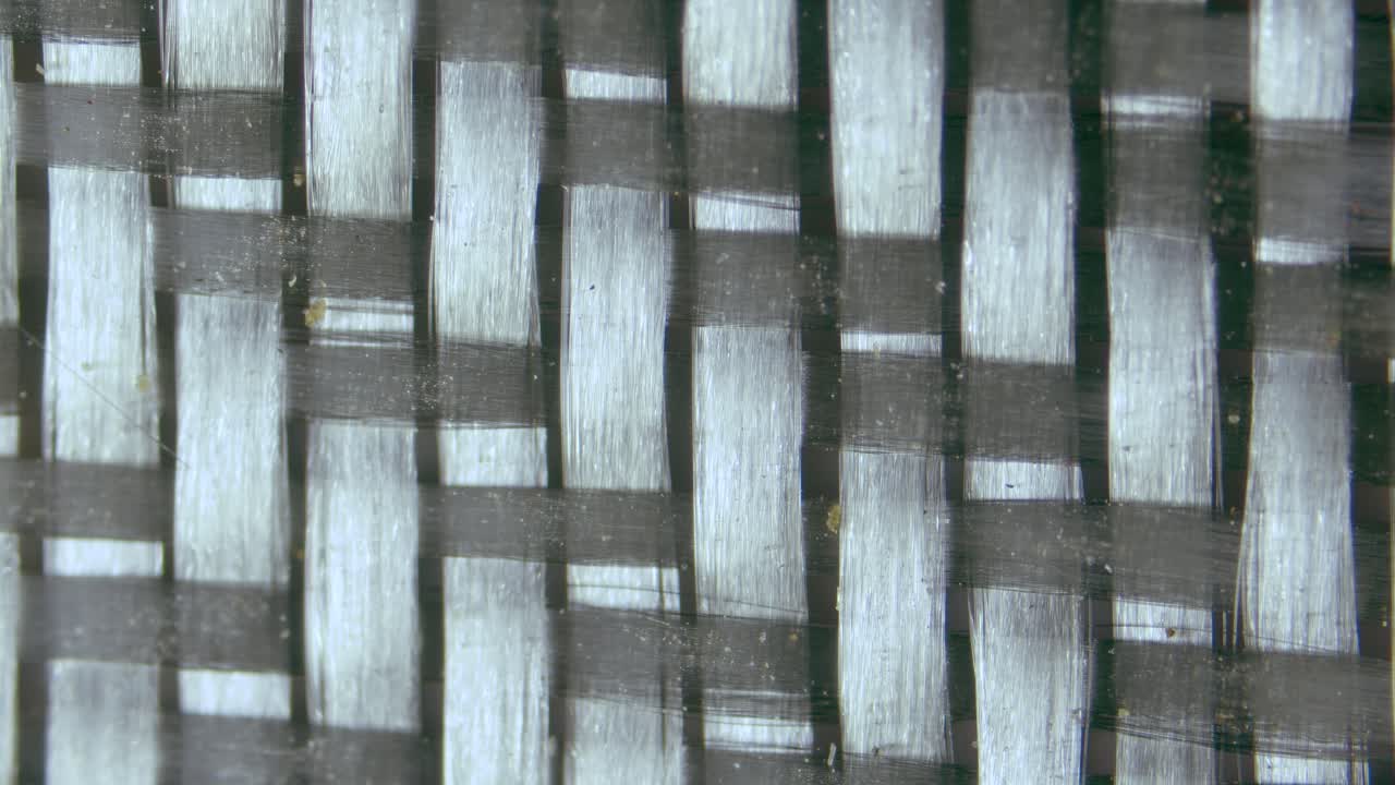 Fiberglass twill weaves under microscope