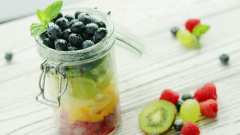 jar filled with colorful fruit