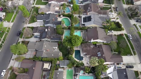 aerial top-down forward over houses with swimming pool at van nuys, los angeles