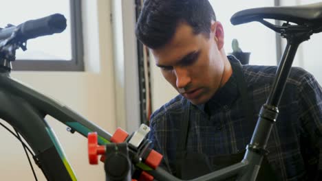 man repairing bicycle in workshop 4k