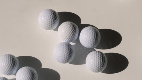 a video of a golf ball of sporting goods rolling around.