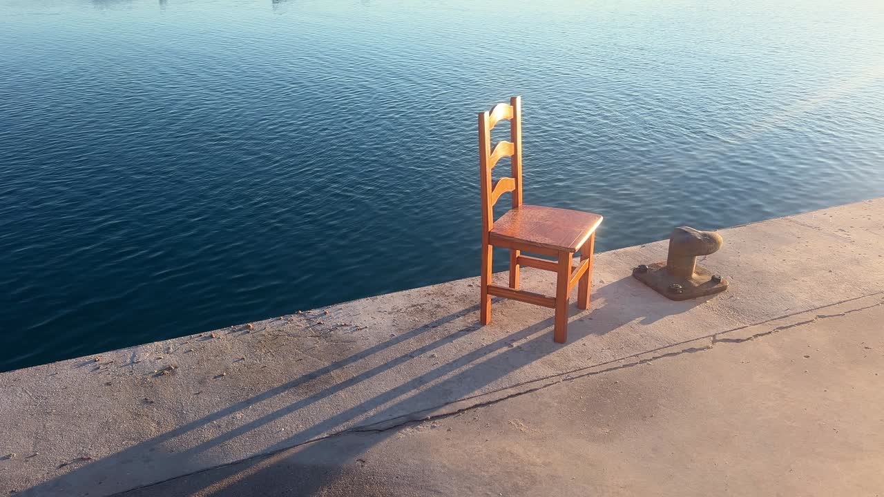A solitary chair on the pier
