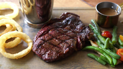 medium rare beef steak with vegetable and french fries