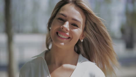 beautiful young woman laughing at camera