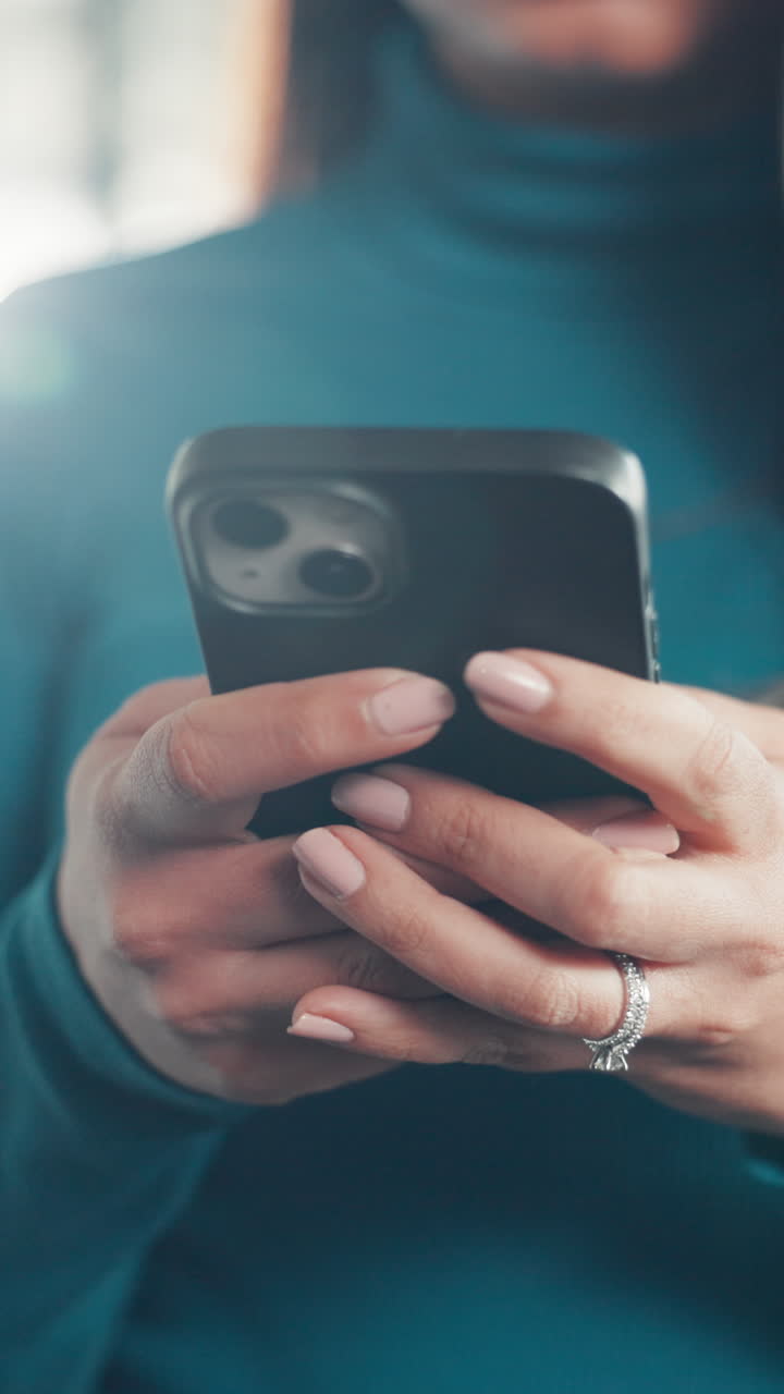 Close-up of Woman's Hands Texting on Smartphone