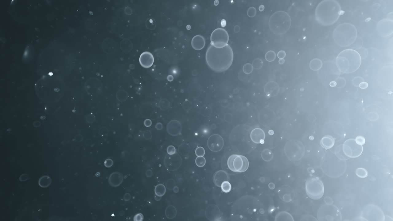 боке из плавающих абстрактных частиц на темном фоне