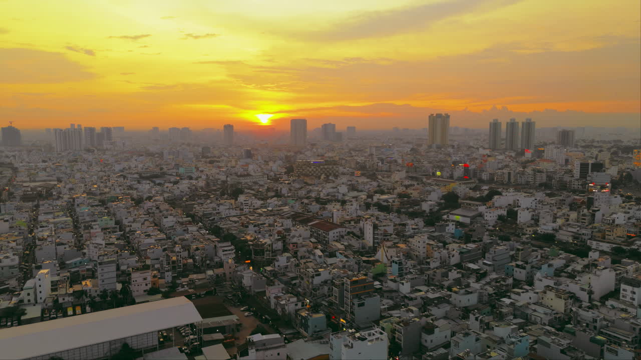 Experience the vibrant energy of Ho Chi City as the sun sets in this captivating aerial footage
