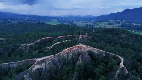 aerial drone backward moving shot over pai canyon in hae hong son, thailand during evening time