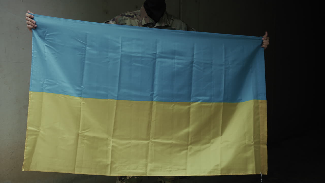 Ukrainian Soldier Waving Flag From Inside Bunker