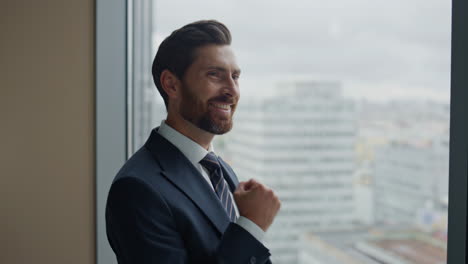 successful boss holding tablet computer rejoicing company achievement close up.