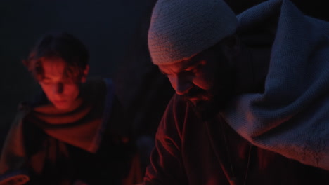 medieval craftsmen by campfire