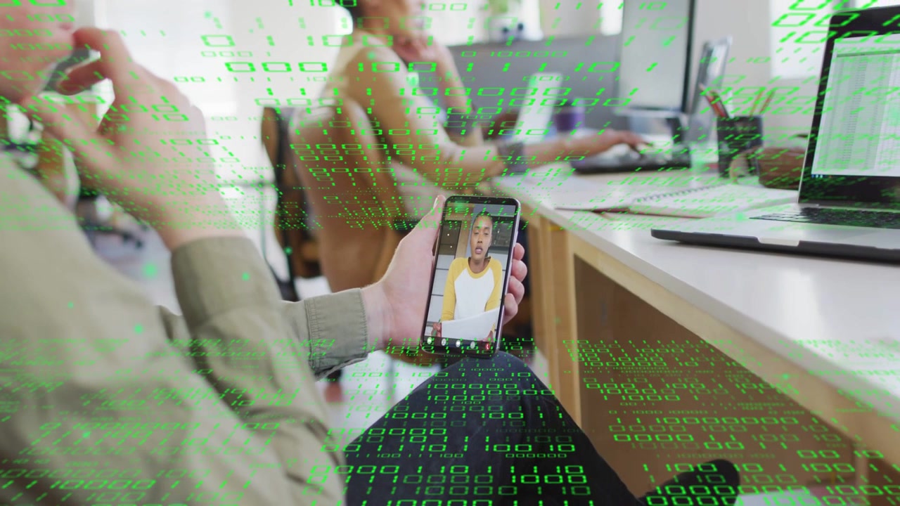 Worker lifting phone on lap, showing remote caller speaking while green code flowing for business